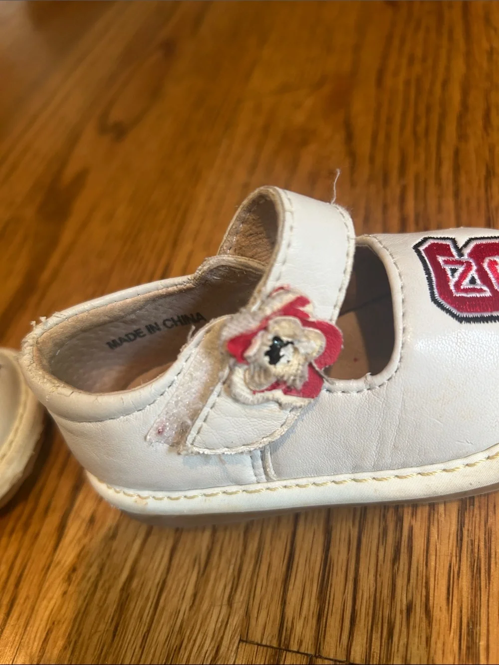 Team Squeaks Kids White Mary Jane Shoes with Red NC State Logo